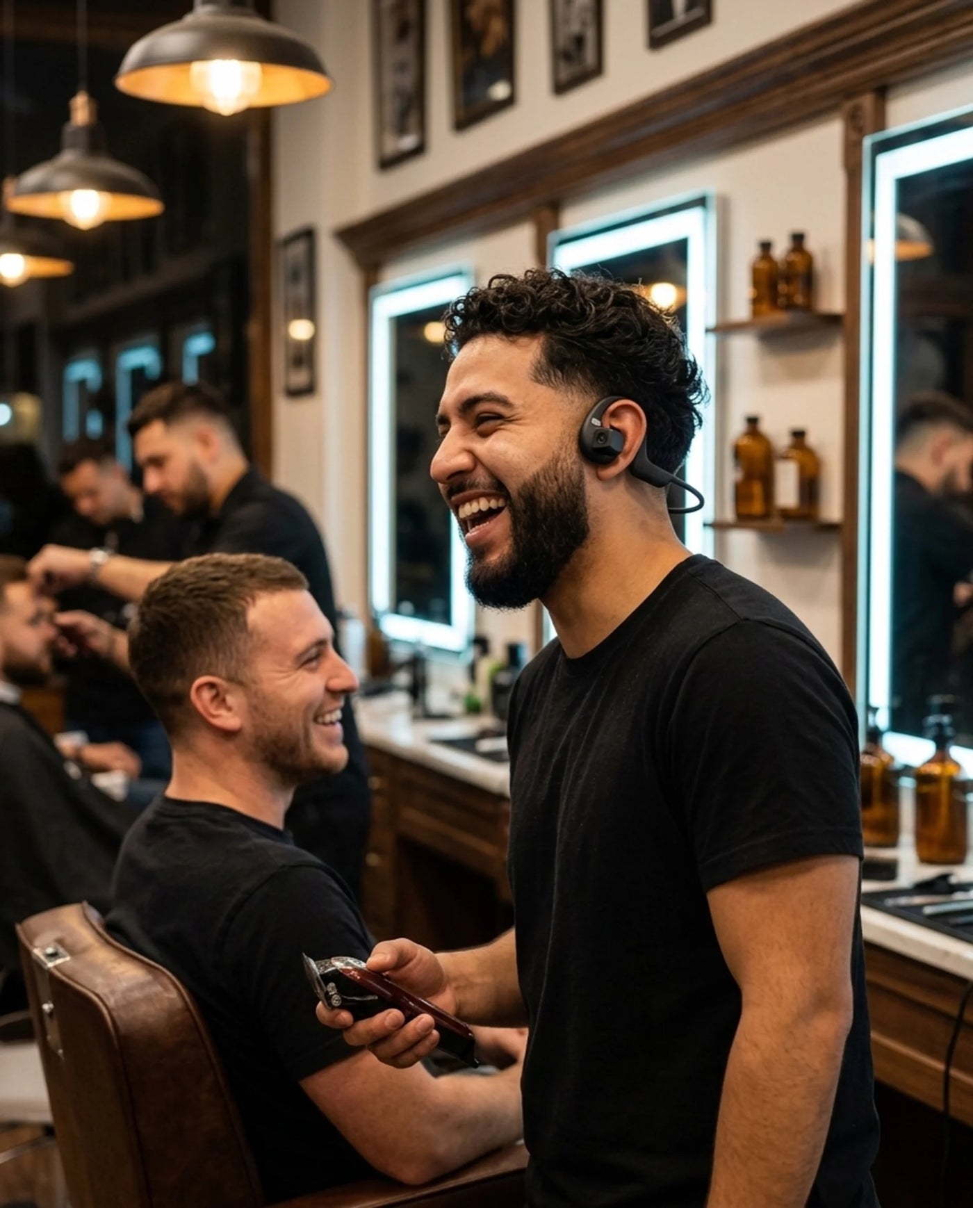 Barber laughing with a client